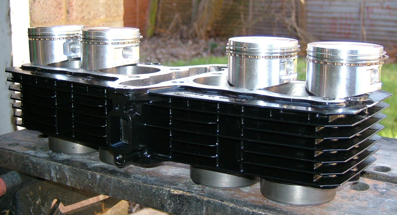 Refurbished cylinder block with new pistons